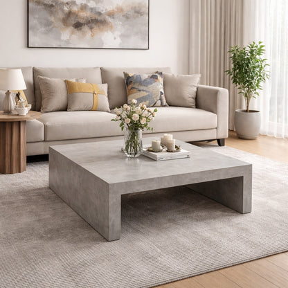 Table basse grise dans un salon contemporain, table basse de salon design au rendu minéral élégant