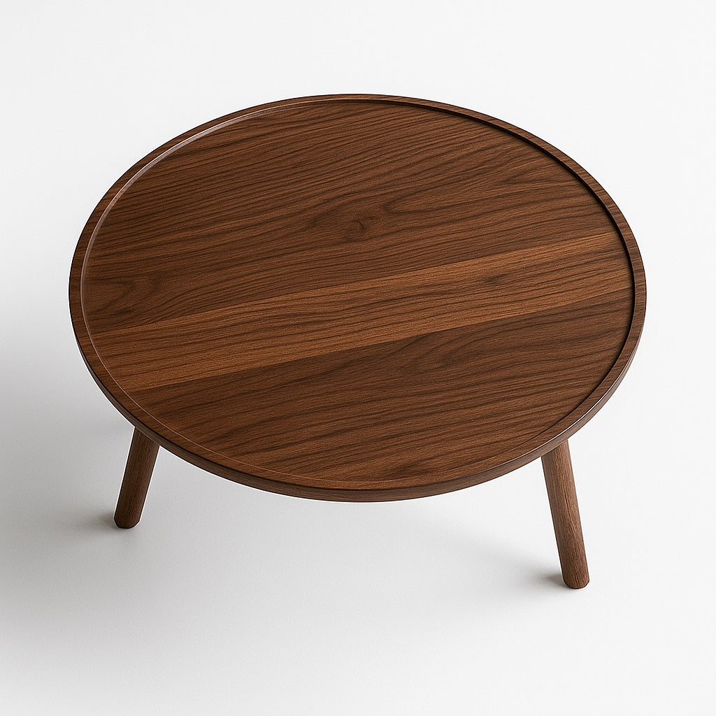 Table basse ronde en bois avec plateau lisse et pieds robustes, style épuré et contemporain.