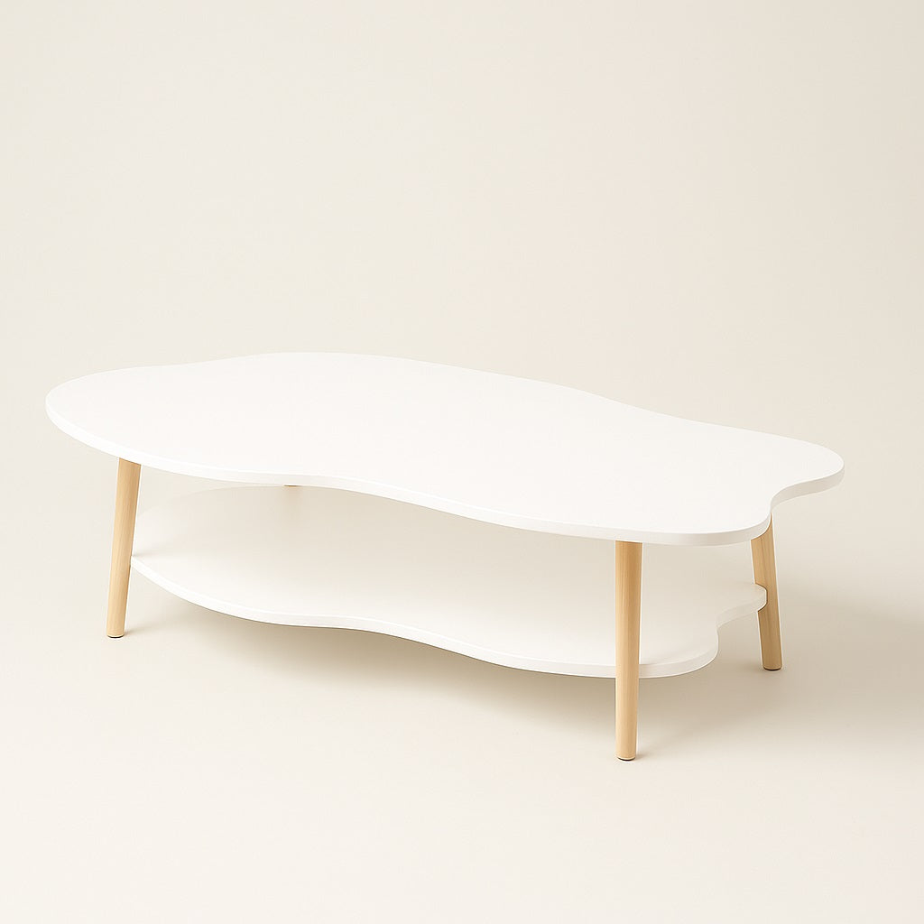Table basse en bois blanc Ondra au design épuré et organique, idéale pour un intérieur moderne et doux.