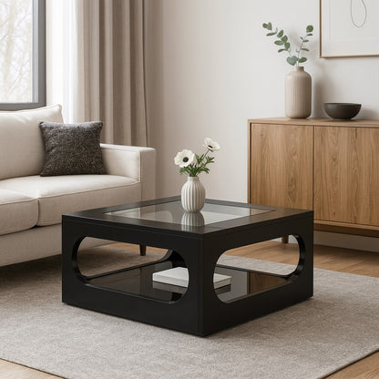 Table basse design noire en verre intégrée dans un salon moderne et épuré.