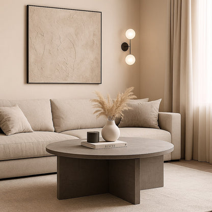 Table basse moderne Ardoa dans salon beige, table basse rondes effet béton chic et élégante.