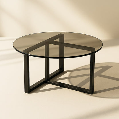 Table basse ronde en verre fumé avec structure métal noir design moderne et épuré.