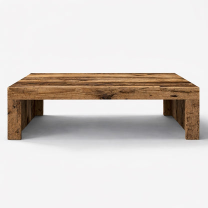 Table basse en bois rectangulaire au design monolithique, idéale comme table basse de salon au style naturel.