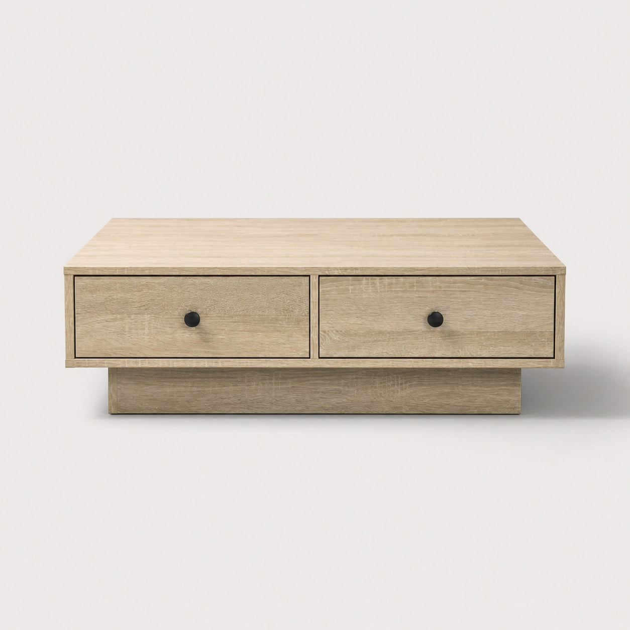 Table basse en bois chêne clair vue face avec tiroirs, table basse de salon épurée et fonctionnelle