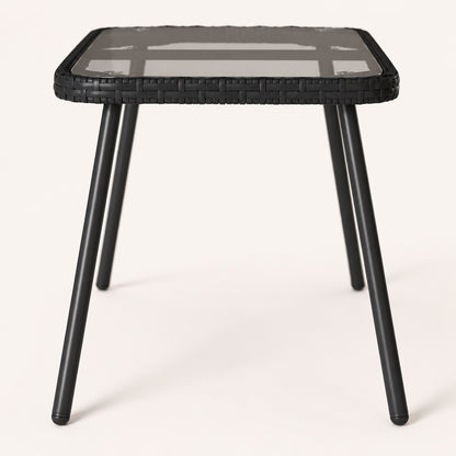 Table basse d’extérieur Nevara noire vue latérale avec finition tressée moderne.
