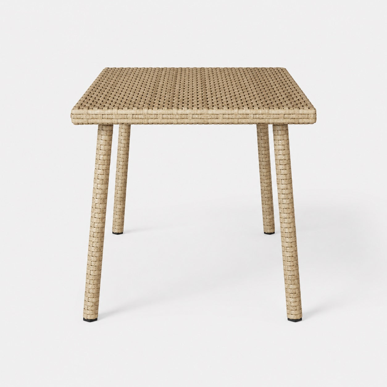 Vue de face d’une table basse de jardin beige rectangulaire en résine tressée pour extérieur