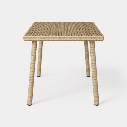 Vue de face d’une table basse de jardin beige rectangulaire en résine tressée pour extérieur