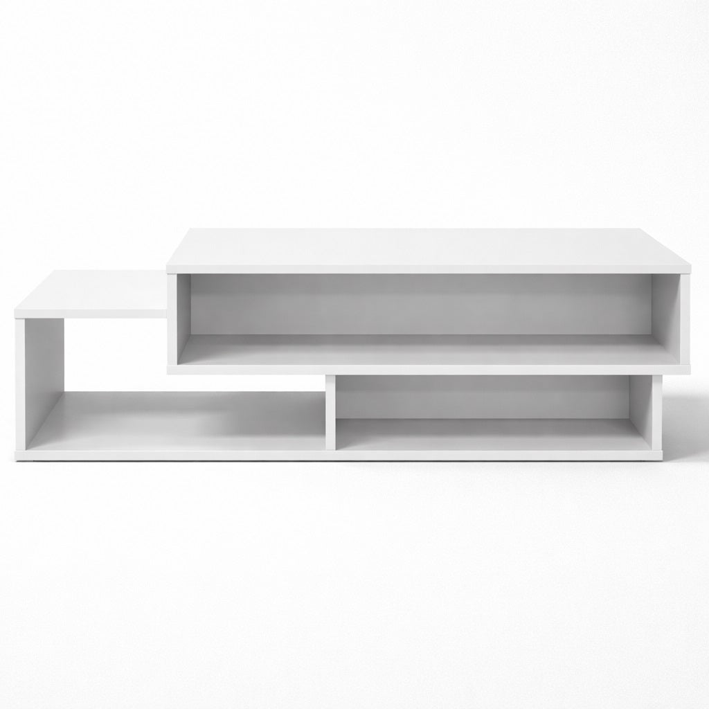Table basse salon blanche vue de face, structure graphique avec étagères intégrées pour un salon moderne.
