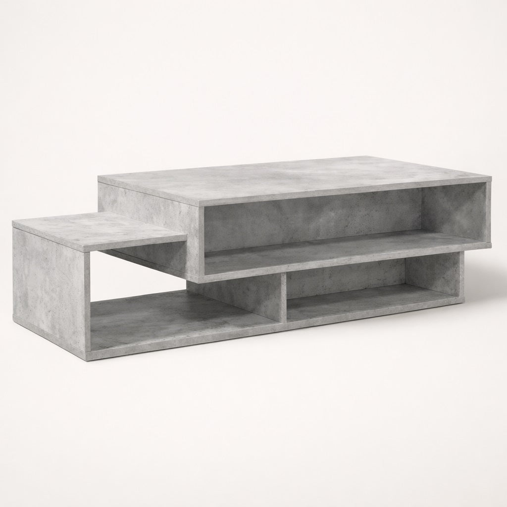 Table basse salon gris béton au design structuré, avec niches de rangement pour un style moderne.