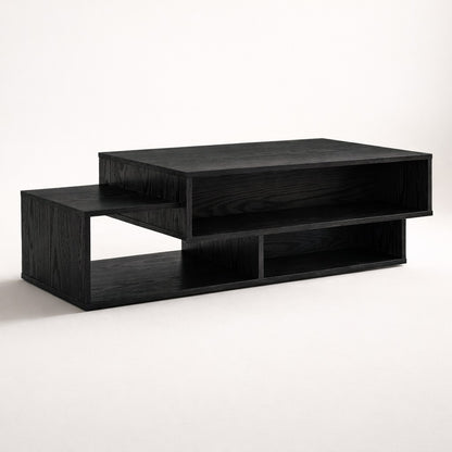 Table basse salon noire au design structuré et épuré, vue en angle, idéale pour un intérieur moderne et élégant.
