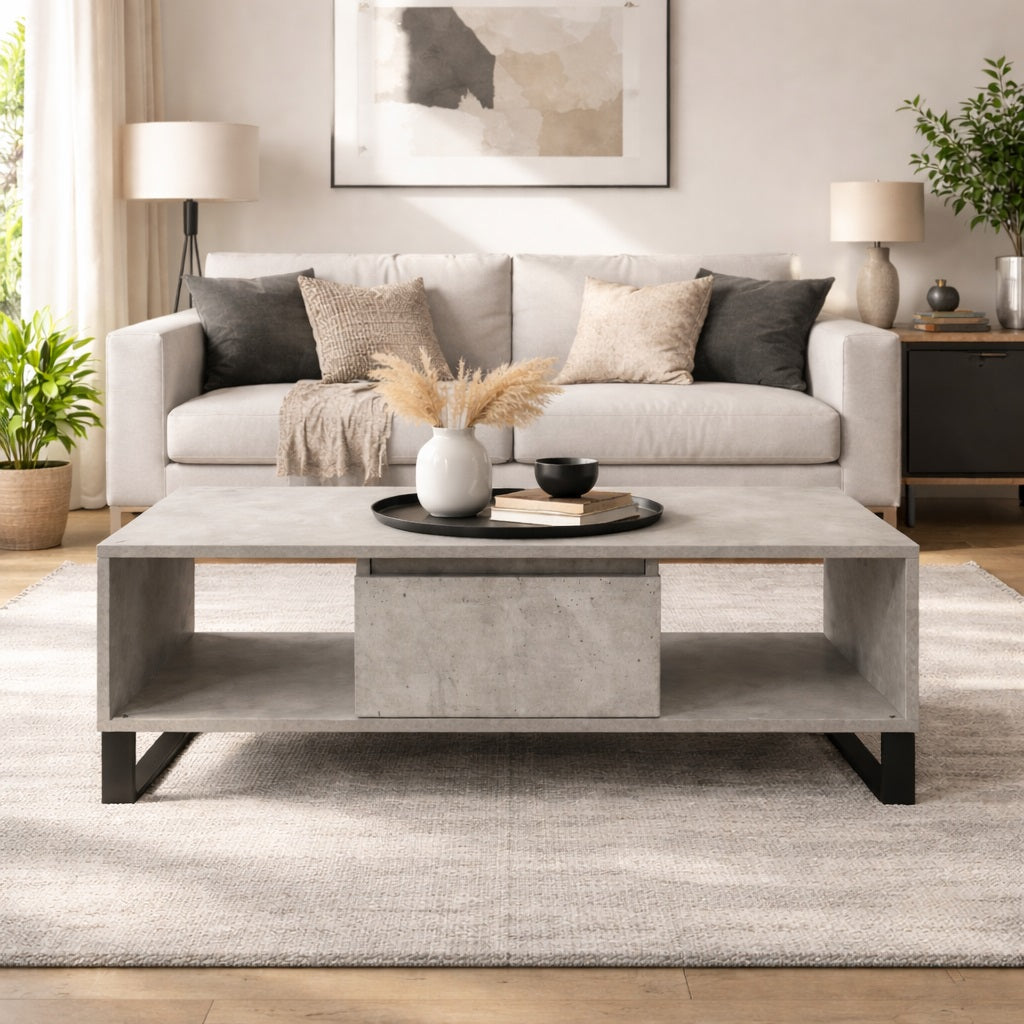 Table basse salon grise effet béton au design moderne, avec rangements intégrés, mise en situation dans un salon élégant