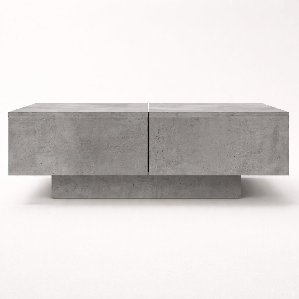 Table basse salon grise vue de face, lignes sobres et structure moderne avec rangement intégré.