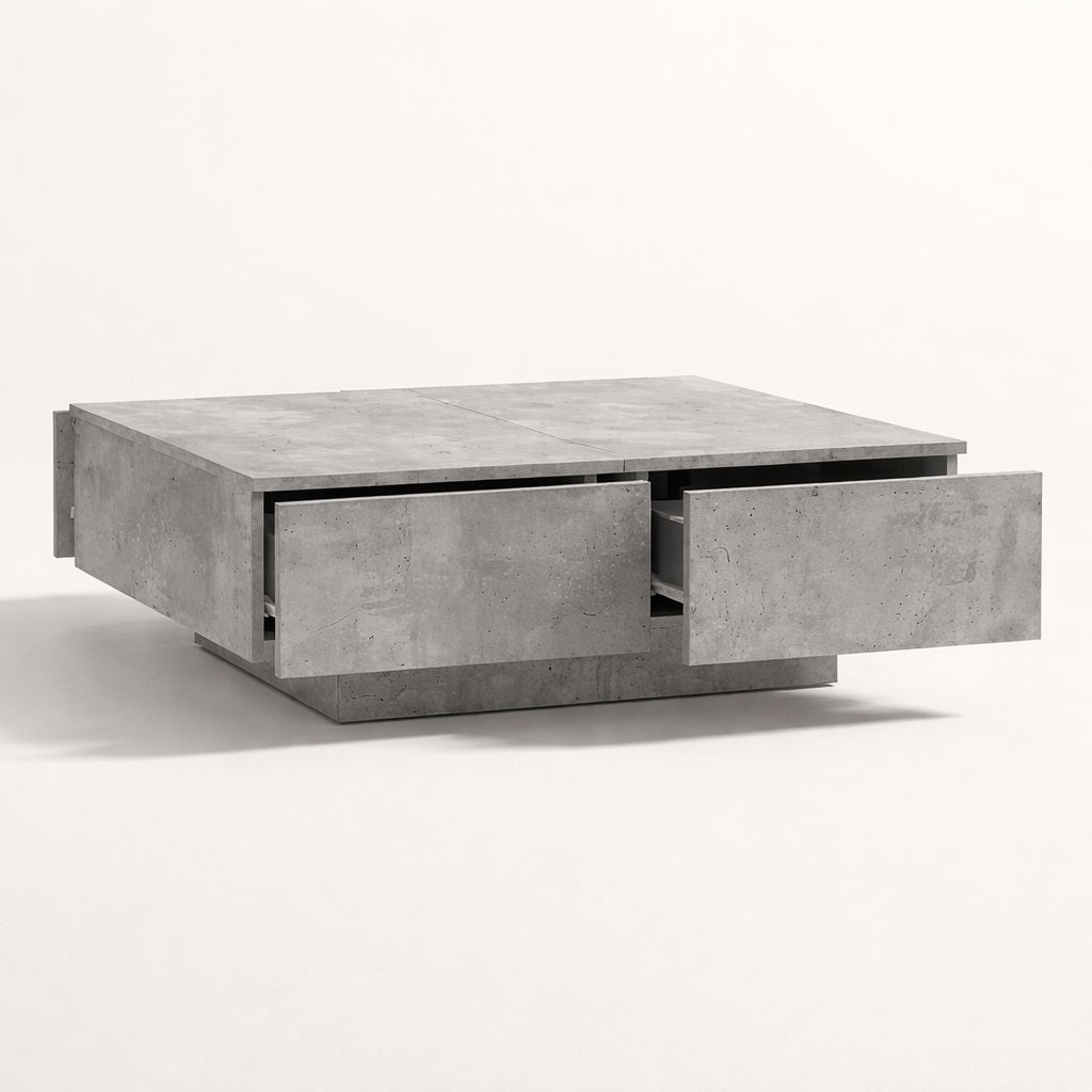 Table basse salon grise avec tiroirs coulissants, finition minérale et design contemporain.