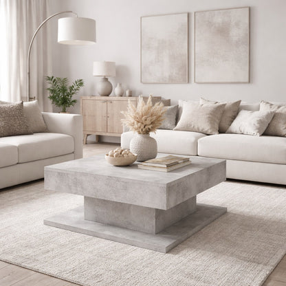 Table basse design grise dans un salon élégant, table basse de salon au style minéral et chic.